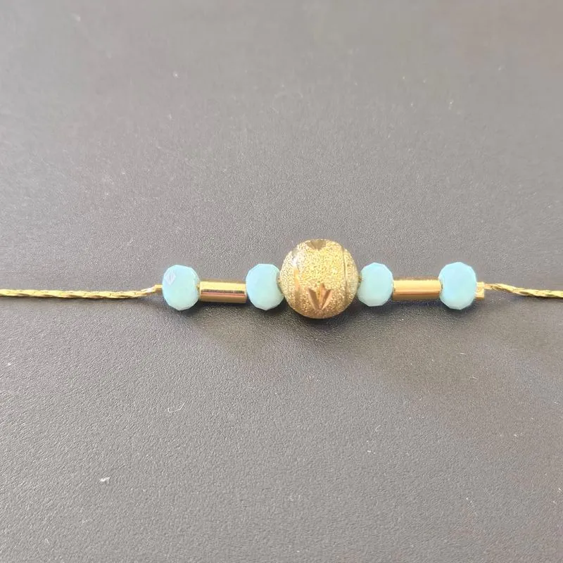 PULSEIRA 4 BOLINHAS AZUIS E UMA BOLA GRANDE NO CENTRO